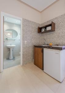 a kitchen with a sink and a counter top at Saint Loukas Studios in Zakynthos