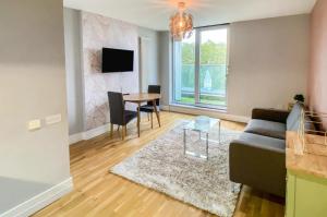 a living room with a couch and a table at Arcus Apartment 33 in Leicester