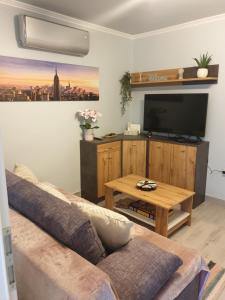 A television and/or entertainment centre at Silver Zsóry Apartman