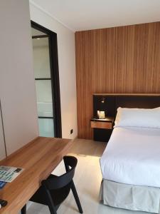 Postel nebo postele na pokoji v ubytování Lastarria Hotel