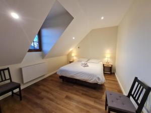 Posteľ alebo postele v izbe v ubytovaní Le Faubourg - Gîte et chambres d'hôte