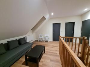 Posedenie v ubytovaní Le Faubourg - Gîte et chambres d'hôte