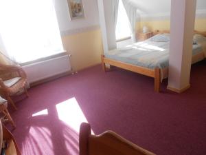 Postel nebo postele na pokoji v ubytování Poska Villa Guesthouse