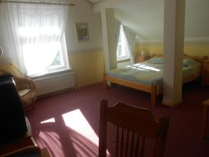 Postel nebo postele na pokoji v ubytování Poska Villa Guesthouse