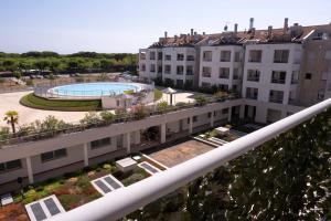 a view from the balcony of a building with a pool at Sky Sun & Sea in Cavallino-Treporti