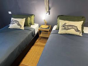 Voodi või voodid majutusasutuse Nego Home Ancient Inn toas