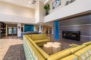 a lobby with couches and a fireplace at Best Western Plus Centralia Hotel & Suites in Centralia