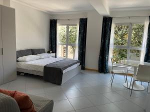 Posteľ alebo postele v izbe v ubytovaní RADA - loft prima fila lungomare sud