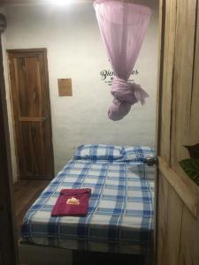 Кровать или кровати в номере Hostal San Andrés de k-noa