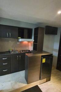 Η κουζίνα ή μικρή κουζίνα στο R.1109 Estudio ejecutivo.