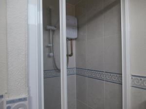 a shower with a glass door in a bathroom at Beautiful 2-Bed Chalet in Mablethorpe in Mablethorpe +5 photos