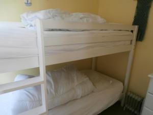 a couple of bunk beds in a room at Beautiful 2-Bed Chalet in Mablethorpe in Mablethorpe