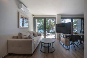 a living room with a couch and a table at Villa Hana Croatia in Mali Lošinj
