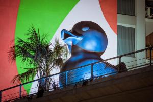 a large blue bird statue sitting on top of a staircase at SLS Buenos Aires Puerto Madero in Buenos Aires