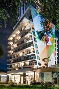 a building with a large mural on the side of it at SLS Buenos Aires Puerto Madero in Buenos Aires