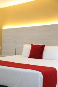 Postel nebo postele na pokoji v ubytování Hotel Súper Estrellas