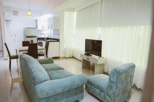 TV a/nebo společenská místnost v ubytování Hotel Súper Estrellas