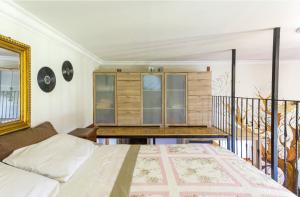 a bedroom with a bed and a desk at La Torre di Barbara in Ardea