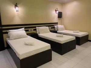 Postel nebo postele na pokoji v ubytování Hotel Benjamin Naval + 9 fotografií