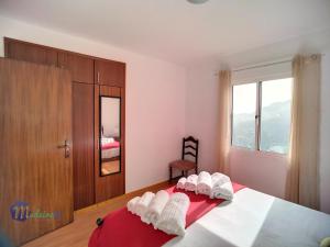 Postel nebo postele na pokoji v ubytování Casa do Romaninho