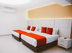 Postel nebo postele na pokoji v ubytování Hotel Súper Estrellas