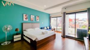 Postel nebo postele na pokoji v ubytování VNAHOMES Serviced Apartment