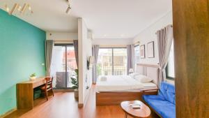 Postel nebo postele na pokoji v ubytování VNAHOMES Serviced Apartment