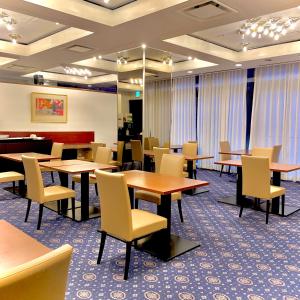 a dining room with tables and chairs at Marroad Inn Akasaka in Tokyo