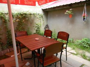 a cocacola table and chairs on a patio at Hotel Beni in Akhaltsikhe