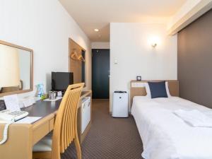 Postel nebo postele na pokoji v ubytování Nagasaki Orion Hotel