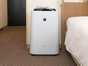 Postel nebo postele na pokoji v ubytování Nagasaki Orion Hotel