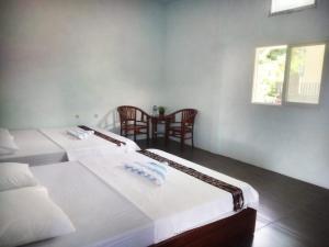 Katil atau katil-katil dalam bilik di Hotel Mehara