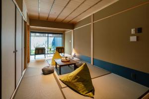 Ένα ή περισσότερα κρεβάτια σε δωμάτιο στο Shiori Machiya House