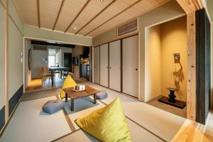 a living room with a couch and a table at Shiori Machiya House in Kanazawa