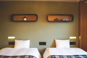 Postel nebo postele na pokoji v ubytování Twin-Line Hotel Karuizawa Japan