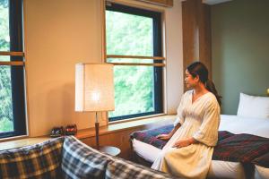 Postel nebo postele na pokoji v ubytování Twin-Line Hotel Karuizawa Japan