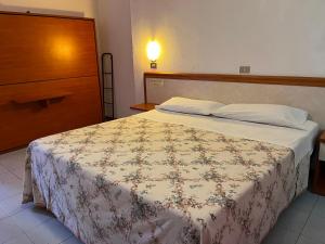 Postel nebo postele na pokoji v ubytování HOTEL ZUCCONI