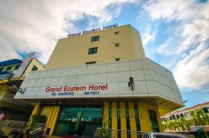 a building with a sign that reads grand eastern hotel at GRAND EASTERN HOTEL SDN BHD in Kota Kinabalu