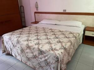 Postel nebo postele na pokoji v ubytování HOTEL ZUCCONI