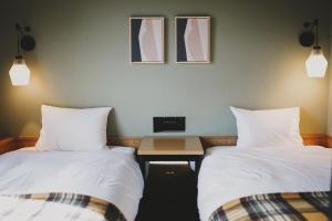 Postel nebo postele na pokoji v ubytování Twin-Line Hotel Karuizawa Japan