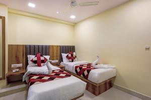 Postel nebo postele na pokoji v ubytování BKC Corporate Hostel Ac Dormitory
