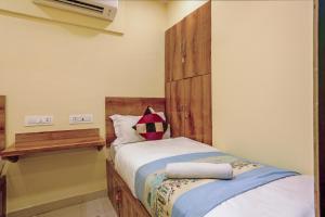 Postel nebo postele na pokoji v ubytování BKC Corporate Hostel Ac Dormitory