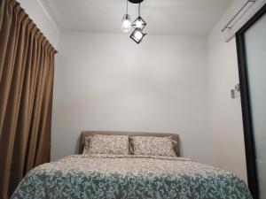 Gulta vai gultas numurā naktsmītnē Usj One Residence @ Homestay