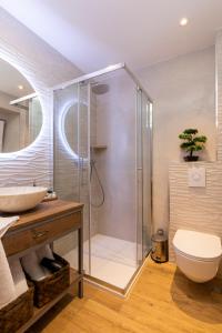 a bathroom with a shower with a toilet and a sink at Nono's House I in Dubrovnik