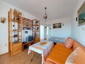 a living room with a couch and a table at Villa Guesthouse Luna in Pečurice