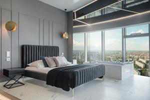Posteľ alebo postele v izbe v ubytovaní In The Sky - Apartamenty w Sky Tower