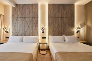 Łóżko lub łóżka w pokoju w obiekcie Hotel Bristol 4 Sup
