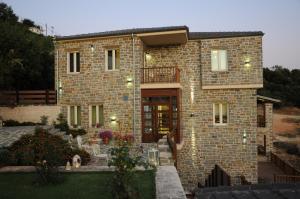 a large brick house with a front entrance at Mir Boutique Hotel in Ioannina