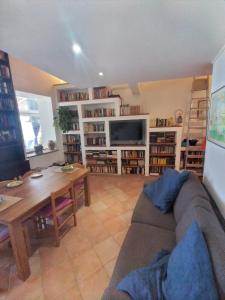 a living room with a couch and a table at Casa di Grazia in Forio d'Ischia