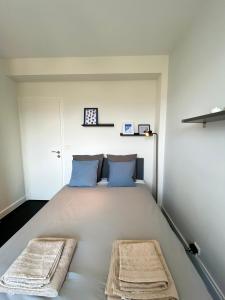 Una cama o camas en una habitación de Appartement cosy - vue sur les montagnes